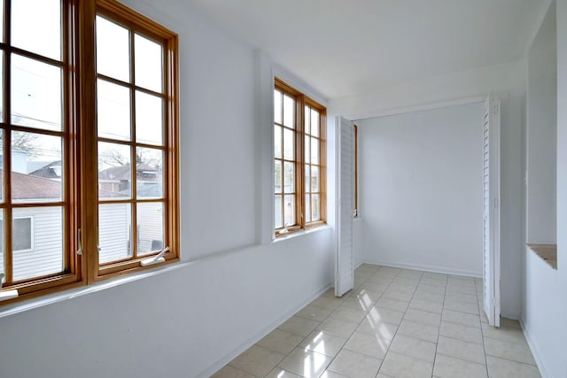 7840 W Cressett Dr, Elmwood Park, IL 60707 - unfurnished room featuring baseboards and light tile patterned flooring
