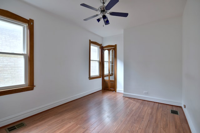 7840 W Cressett Dr, Elmwood Park, IL 60707 - unfurnished room with wood finished floors, ceiling fan, and baseboards