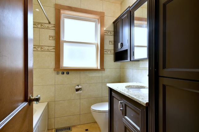 7840 W Cressett Dr, Elmwood Park, IL 60707 - full bath featuring tile walls, vanity, toilet, tile patterned flooring, and a bath