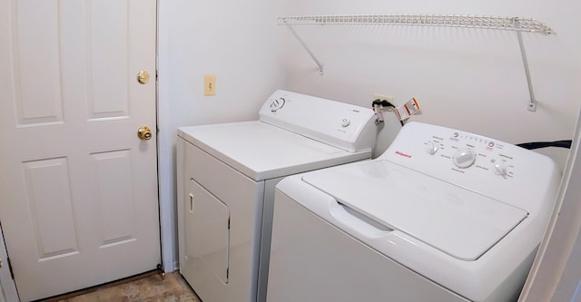 laundry room featuring laundry area and separate washer and dryer