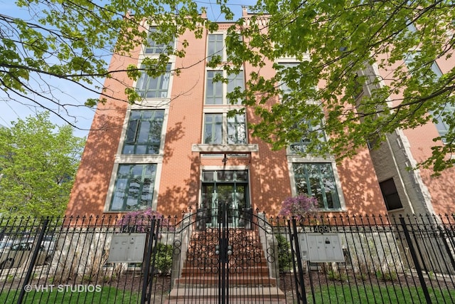 view of building exterior with a fenced front yard