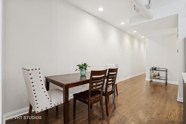 dining space with recessed lighting, baseboards, and dark wood-style floors