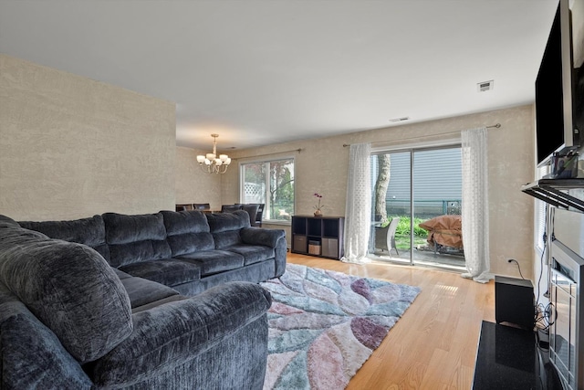 387 Coventrey Ct Unit 0, Clarendon Hills, IL 60514 - living room featuring a chandelier and wood finished floors