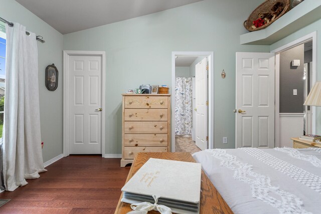 611 Northgate Dr, Saint Joseph, IL 61873 - bedroom with lofted ceiling, dark wood-style flooring, and baseboards