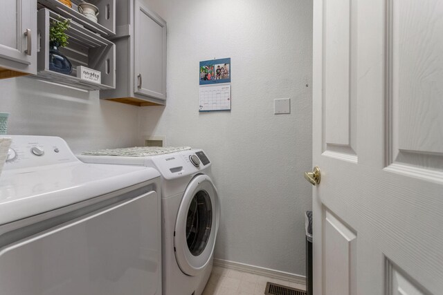 611 Northgate Dr, Saint Joseph, IL 61873 - washroom with cabinet space, independent washer and dryer, and baseboards