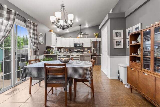 611 Northgate Dr, Saint Joseph, IL 61873 - tiled dining room featuring a chandelier, lofted ceiling, a ceiling fan, and wainscoting