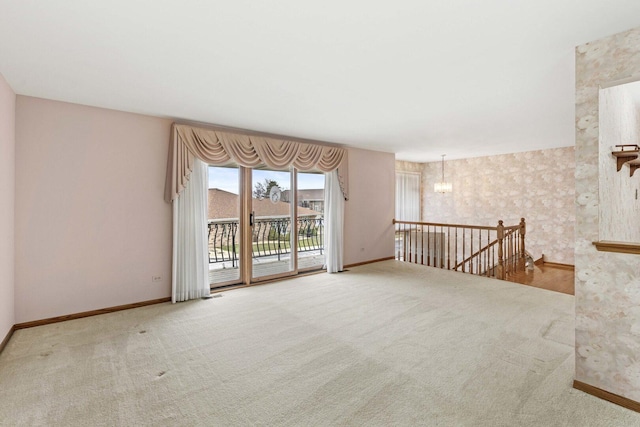 unfurnished room featuring baseboards, visible vents, and carpet