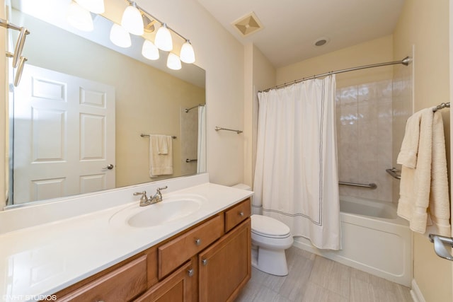 bathroom with toilet, visible vents, shower / bath combination with curtain, and vanity