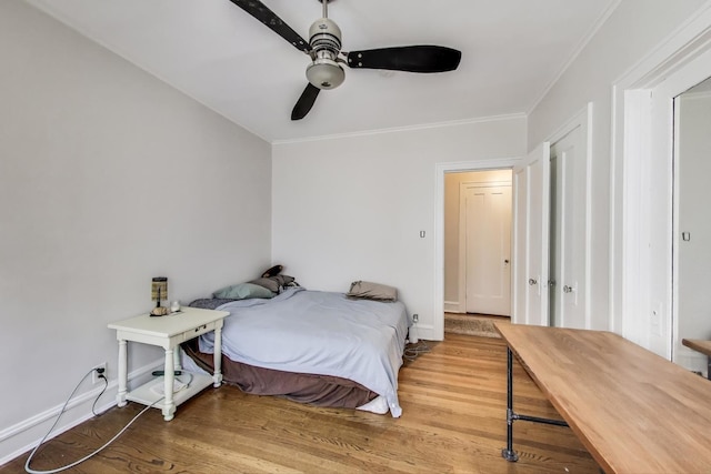 918 Michigan Ave Unit 3, Evanston, IL 60202 - bedroom featuring wood finished floors, crown molding, and ceiling fan