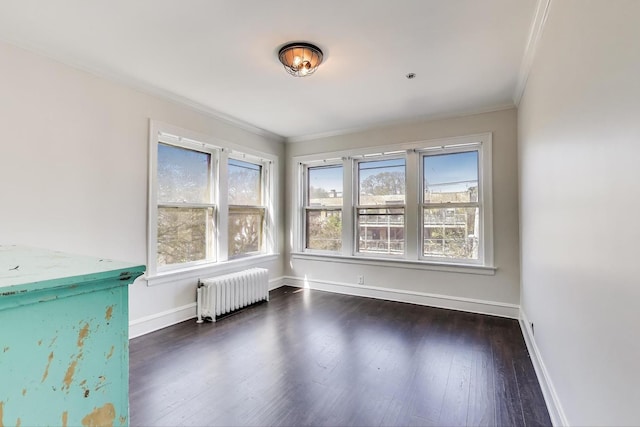 918 Michigan Ave Unit 3, Evanston, IL 60202 - unfurnished room featuring radiator, ornamental molding, and dark wood-style floors