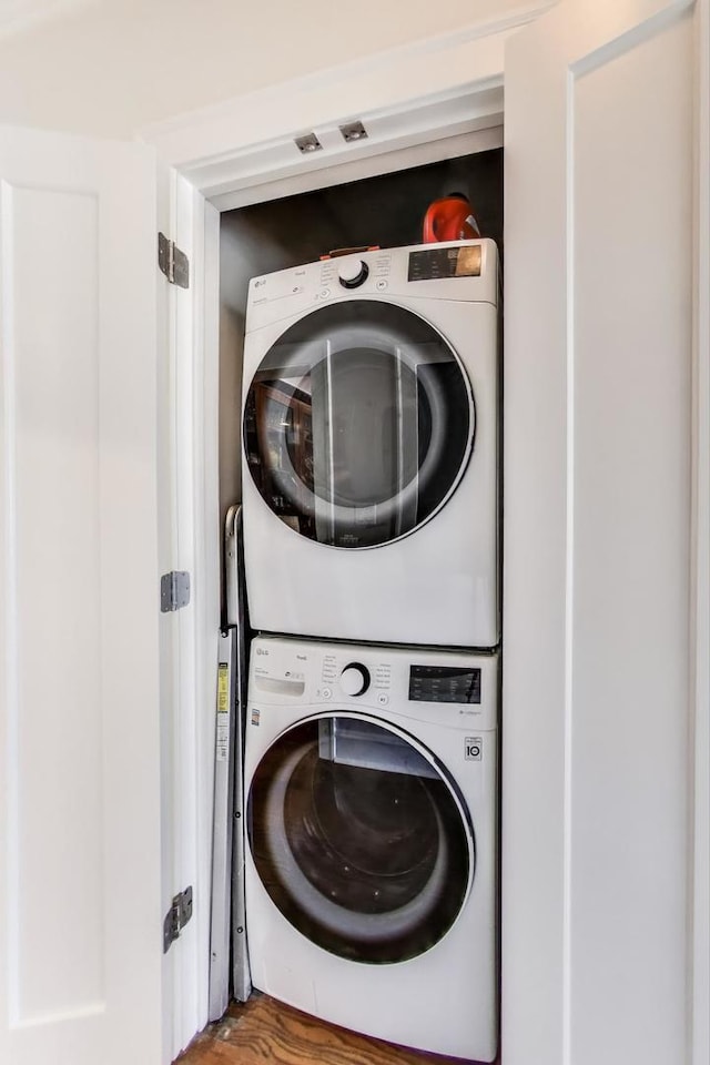918 Michigan Ave Unit 3, Evanston, IL 60202 - washroom with stacked washer / drying machine and wood finished floors