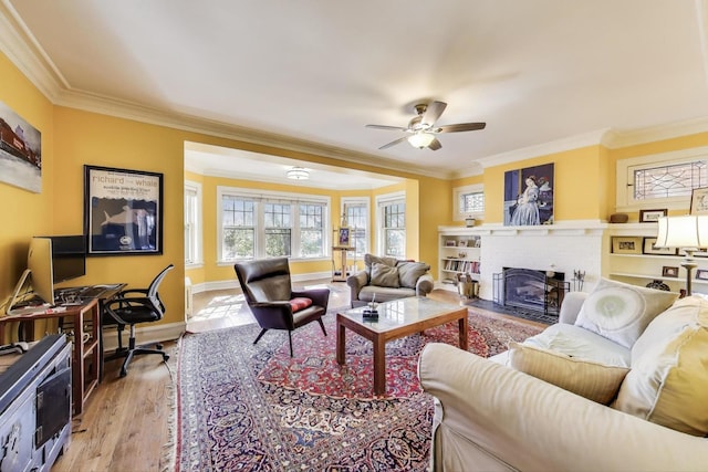 918 Michigan Ave Unit 3, Evanston, IL 60202 - living room with crown molding, ceiling fan, light wood-type flooring, a brick fireplace, and a desk