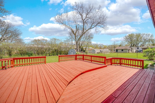 1595 Highland Blvd, Hoffman Estates, IL 60169 - deck with a lawn, an outbuilding, a fenced backyard, and a storage unit