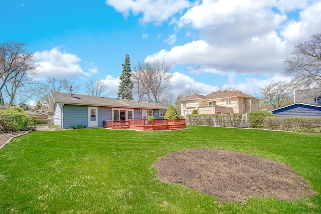 1595 Highland Blvd, Hoffman Estates, IL 60169 - back of property featuring a lawn, fence, and a wooden deck