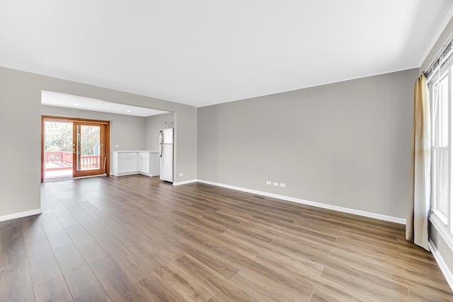 1595 Highland Blvd, Hoffman Estates, IL 60169 - unfurnished living room featuring baseboards and dark wood finished floors