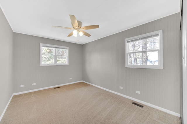 1595 Highland Blvd, Hoffman Estates, IL 60169 - carpeted spare room featuring baseboards, a ceiling fan, and visible vents