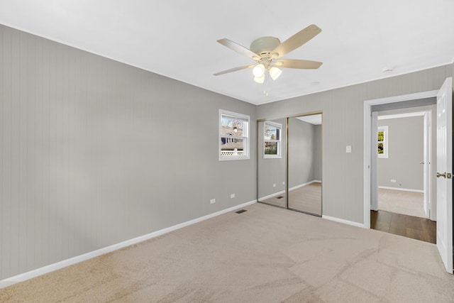 1595 Highland Blvd, Hoffman Estates, IL 60169 - unfurnished bedroom featuring ceiling fan, visible vents, carpet floors, baseboards, and a closet