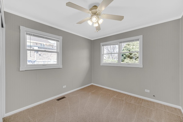 1595 Highland Blvd, Hoffman Estates, IL 60169 - carpeted spare room with visible vents, a ceiling fan, baseboards, and crown molding