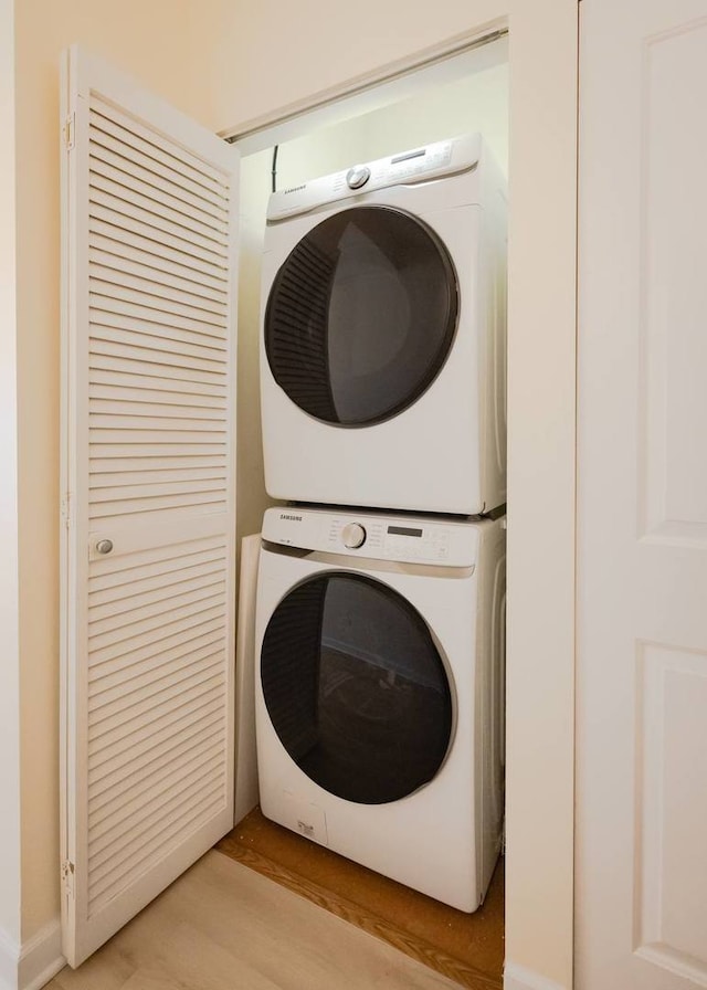 laundry room with laundry area and stacked washer / drying machine