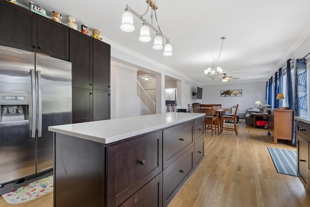 1000 Salvia Ln, Joliet, IL 60431 - kitchen with a chandelier, stainless steel refrigerator with ice dispenser, light countertops, light wood-style floors, and a kitchen island
