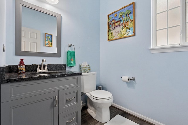 1000 Salvia Ln, Joliet, IL 60431 - half bath featuring vanity, toilet, baseboards, and wood finished floors