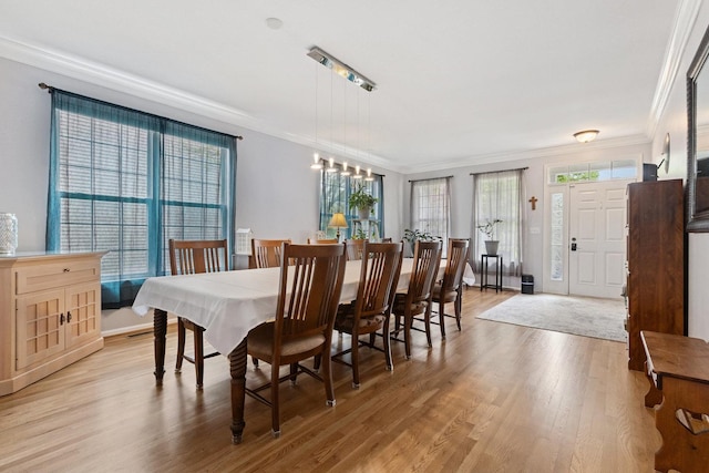 1000 Salvia Ln, Joliet, IL 60431 - dining space featuring baseboards, crown molding, and light wood-type flooring