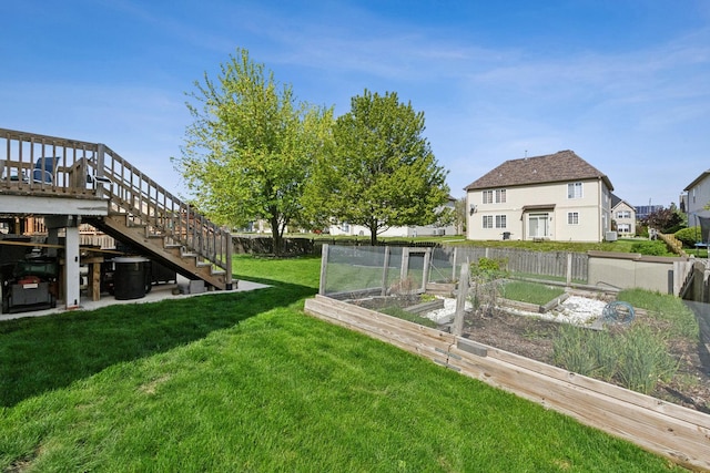 1000 Salvia Ln, Joliet, IL 60431 - view of yard featuring stairway, fence, and a vegetable garden