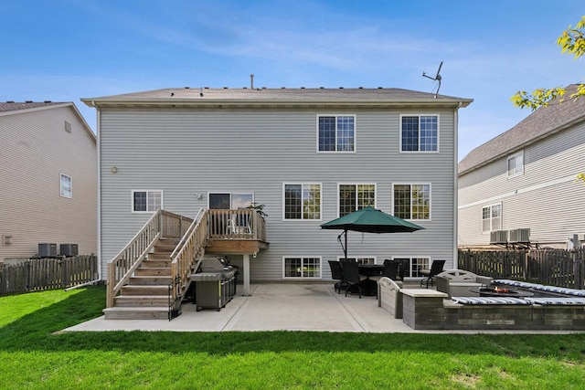 1000 Salvia Ln, Joliet, IL 60431 - rear view of house with a fenced backyard, a patio area, stairway, and a lawn