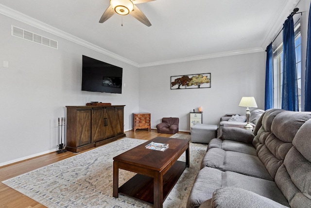 1000 Salvia Ln, Joliet, IL 60431 - living area featuring crown molding, a ceiling fan, visible vents, and wood finished floors