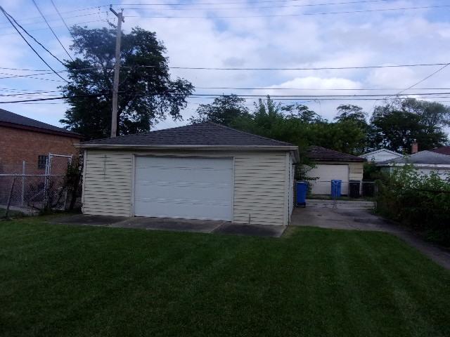9105 S Parnell Ave, Chicago, IL 60620 - detached garage featuring fence and driveway