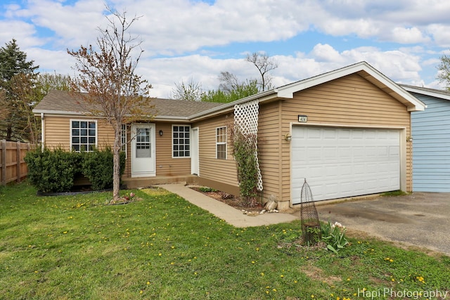 404 Rand Rd, Lakemoor, IL 60050 - single story home with a garage, fence, a front lawn, and aphalt driveway