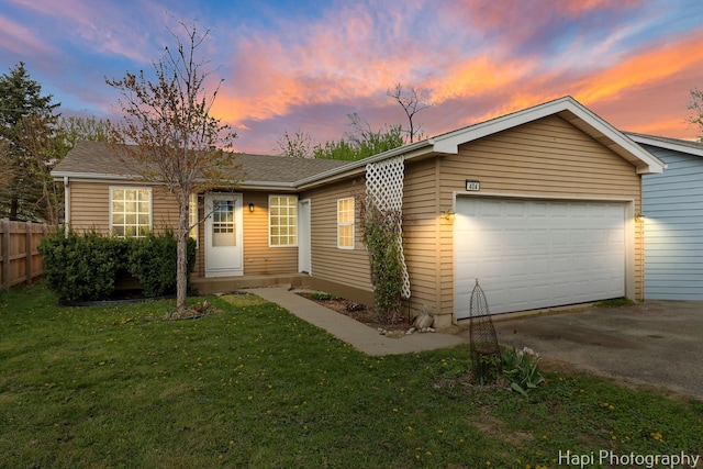 404 Rand Rd, Lakemoor, IL 60050 - view of front facade with fence, a garage, driveway, and a front yard