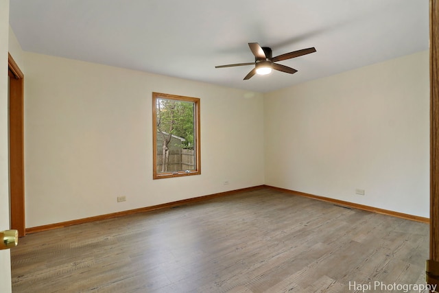 404 Rand Rd, Lakemoor, IL 60050 - unfurnished room with light wood-type flooring, baseboards, ceiling fan, and visible vents