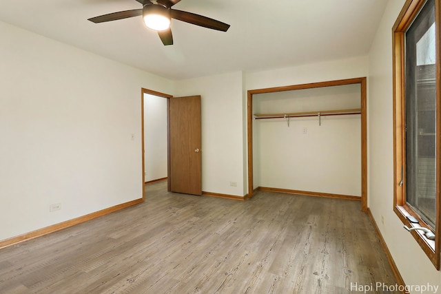 404 Rand Rd, Lakemoor, IL 60050 - unfurnished bedroom featuring baseboards, light wood finished floors, ceiling fan, and a closet