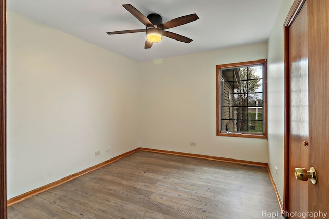 404 Rand Rd, Lakemoor, IL 60050 - spare room featuring baseboards, a ceiling fan, and wood finished floors