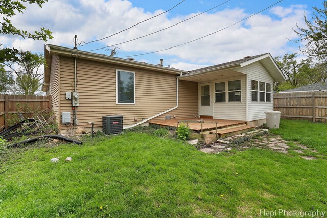 404 Rand Rd, Lakemoor, IL 60050 - back of house with a yard, a deck, central AC, and fence