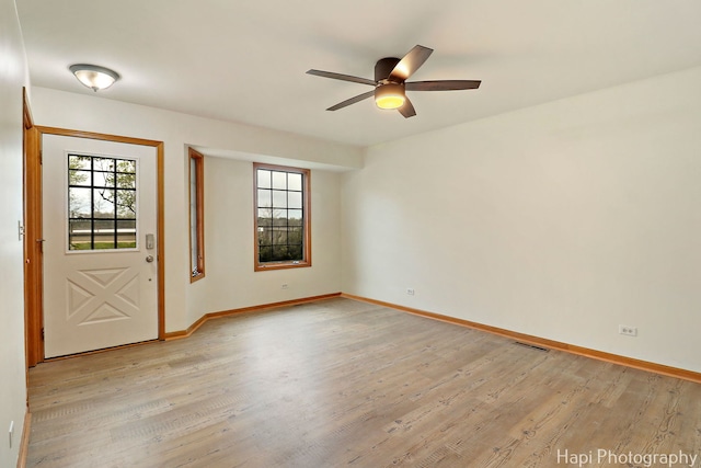 404 Rand Rd, Lakemoor, IL 60050 - interior space with a ceiling fan, baseboards, visible vents, and light wood-style floors
