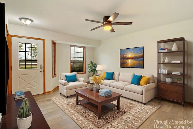 404 Rand Rd, Lakemoor, IL 60050 - living area with a healthy amount of sunlight, baseboards, a ceiling fan, and light wood-style flooring