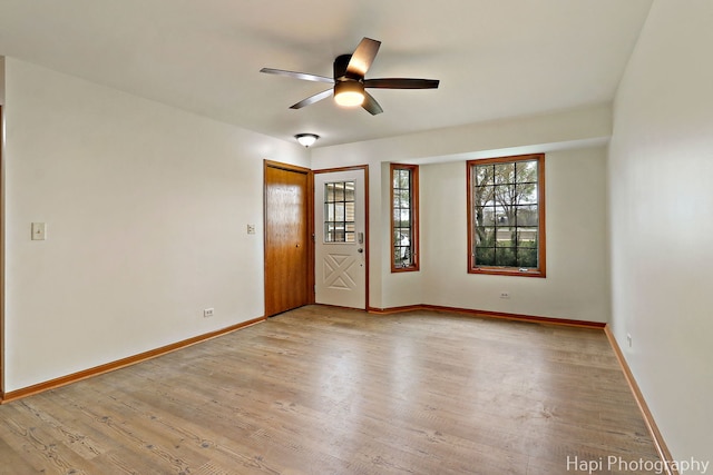 404 Rand Rd, Lakemoor, IL 60050 - unfurnished room featuring ceiling fan, baseboards, and light wood-type flooring