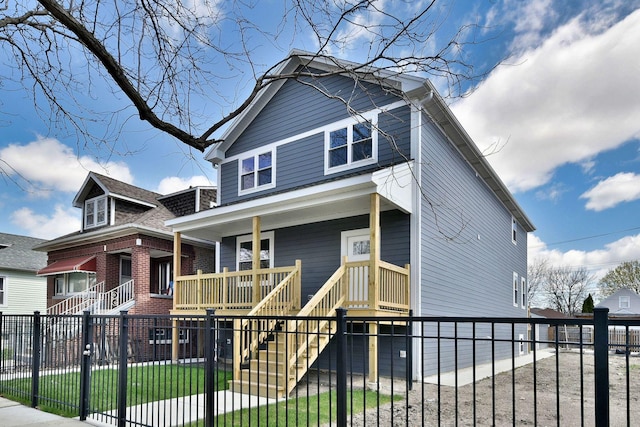 2123 N Austin Ave, Chicago, IL 60639 - view of front of home with stairs, a fenced front yard, a porch, and brick siding