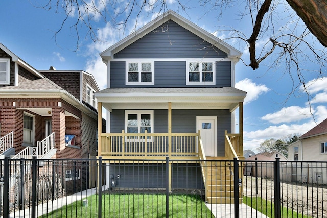 2123 N Austin Ave, Chicago, IL 60639 - view of front facade featuring a gate, a fenced front yard, covered porch, and stairway