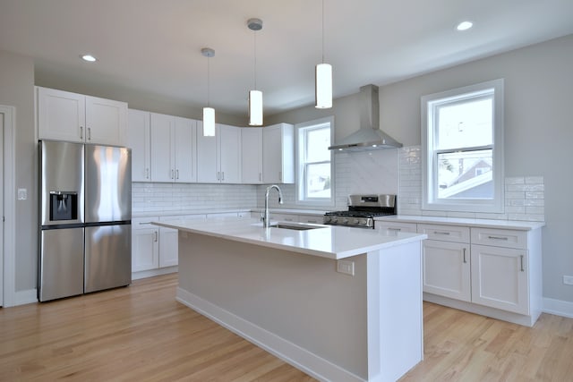 2123 N Austin Ave, Chicago, IL 60639 - kitchen with a sink, decorative backsplash, stainless steel appliances, and wall chimney exhaust hood
