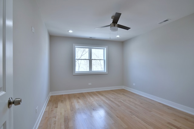 2123 N Austin Ave, Chicago, IL 60639 - empty room featuring a ceiling fan, baseboards, visible vents, and light wood finished floors
