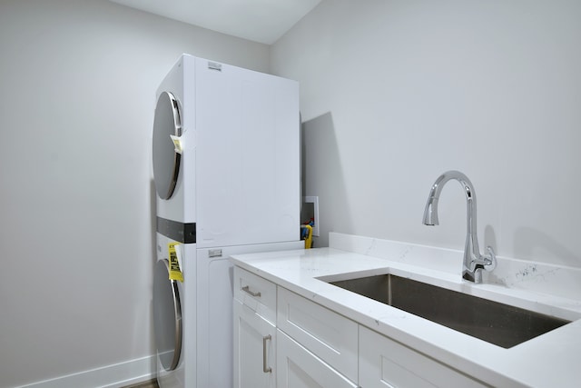2123 N Austin Ave, Chicago, IL 60639 - clothes washing area with a sink, cabinet space, and stacked washer / dryer