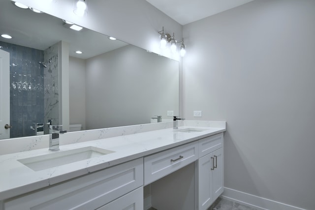 2123 N Austin Ave, Chicago, IL 60639 - bathroom with a sink, double vanity, toilet, and tiled shower