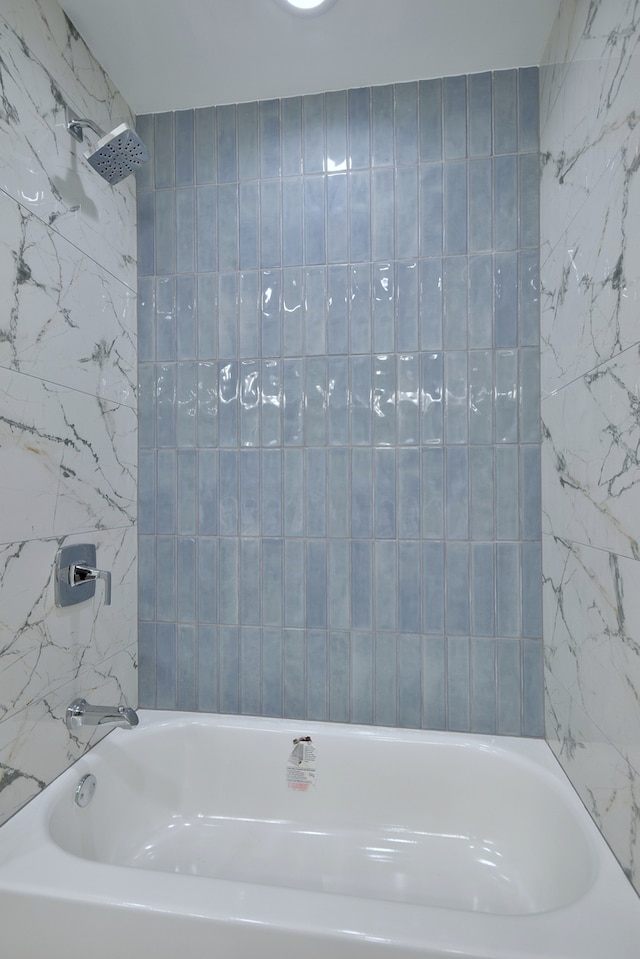 2123 N Austin Ave, Chicago, IL 60639 - bathroom featuring tile walls and washtub / shower combination