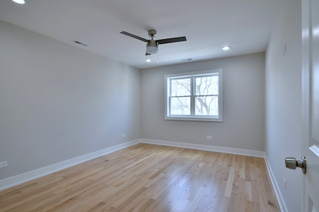 2123 N Austin Ave, Chicago, IL 60639 - spare room with baseboards, a ceiling fan, light wood-type flooring, and visible vents