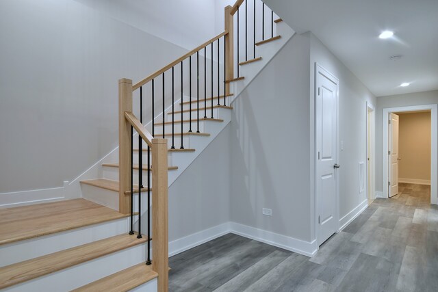 2123 N Austin Ave, Chicago, IL 60639 - staircase featuring recessed lighting, baseboards, and wood finished floors