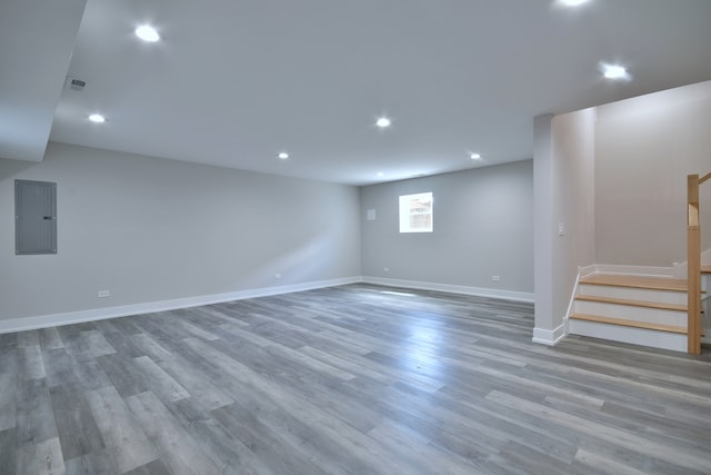 2123 N Austin Ave, Chicago, IL 60639 - below grade area with electric panel, wood finished floors, stairway, baseboards, and recessed lighting