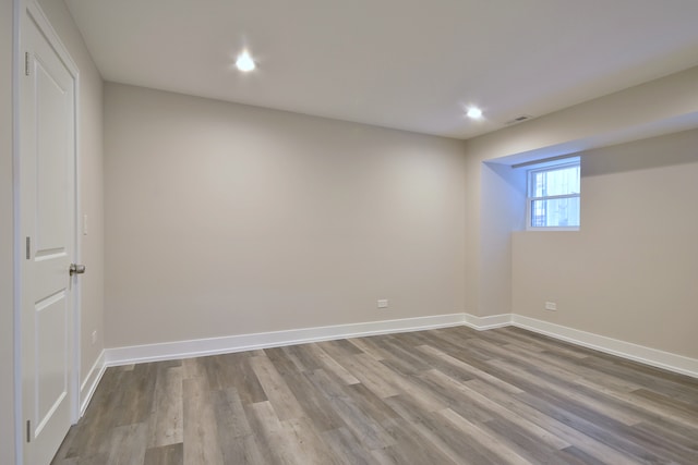 2123 N Austin Ave, Chicago, IL 60639 - below grade area with baseboards, recessed lighting, wood finished floors, and visible vents